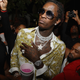 Young Thug wears a Versace for women blouse, $987 / Image via Getty